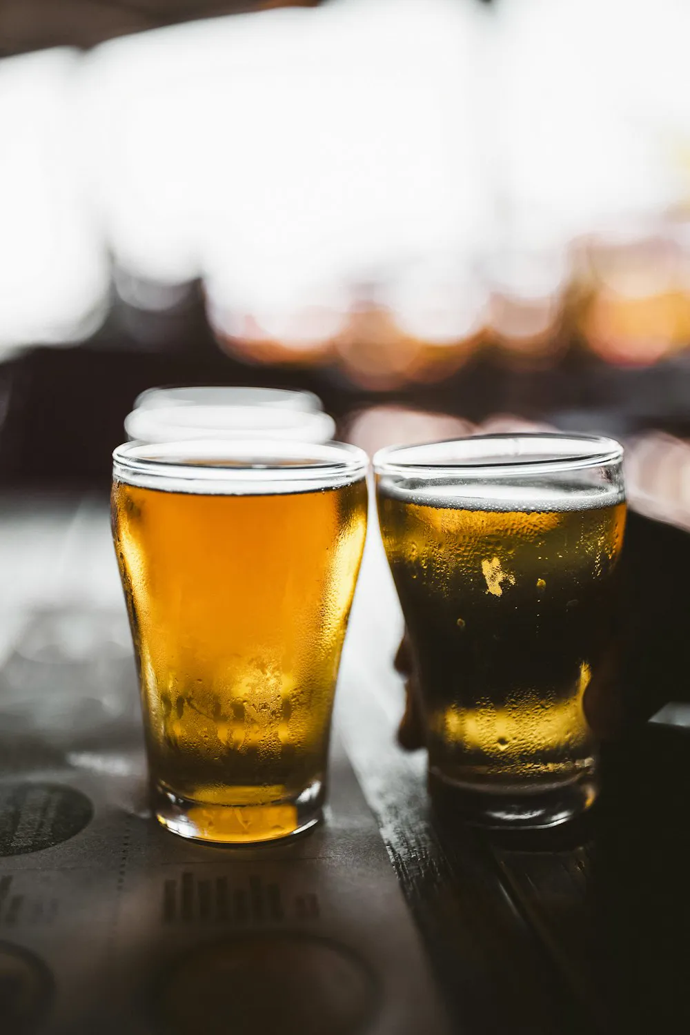 Two pints of lager on the bar